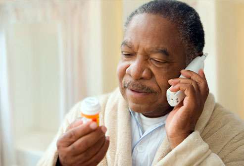 getty_rf_photo_of_man_on_phone_with_prescription