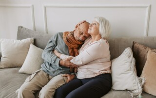 Elderly couple hugging