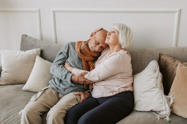 Elderly couple hugging