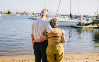 Couple standing by the harbor