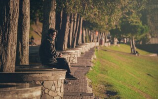 Man sitting at a park