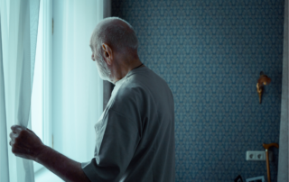 Man looking out of window