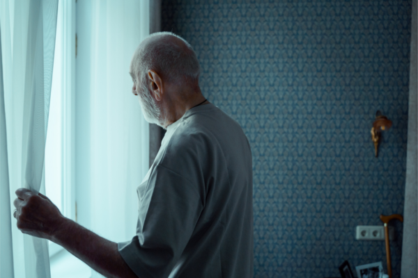 Man looking out of window